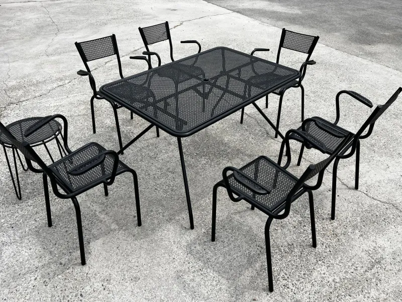 Pamono Perforated Metal Armchairs and Table in the style of Mathieu Matégot, 1950s, Set of 7