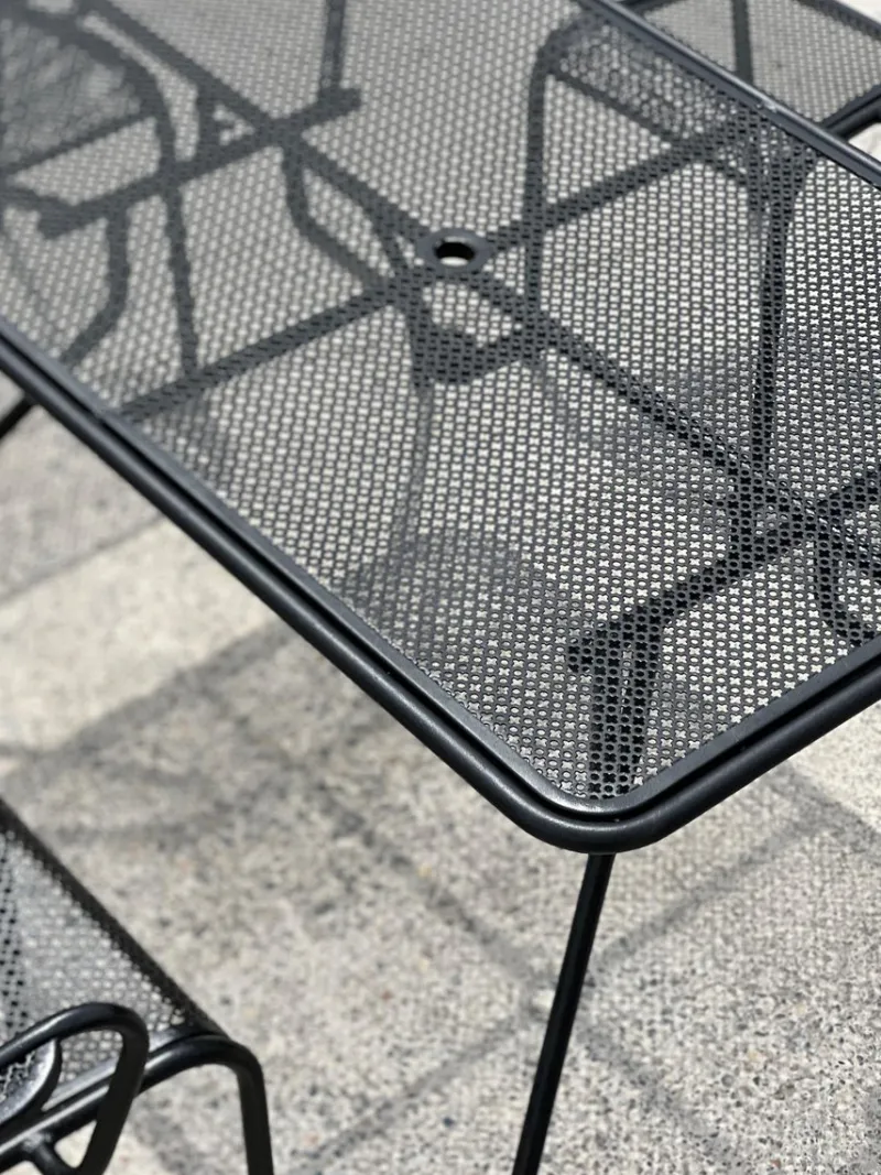 Pamono Perforated Metal Armchairs and Table in the style of Mathieu Matégot, 1950s, Set of 7