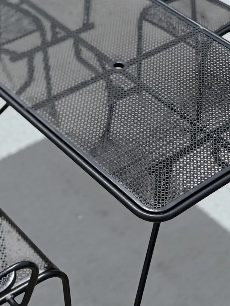 Pamono Perforated Metal Armchairs and Table in the style of Mathieu Matégot, 1950s, Set of 7