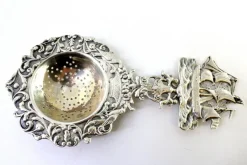 Hot Pamono Silver Tea Strainer with Reliefs, Applications and Caravel Cut-Out Handle