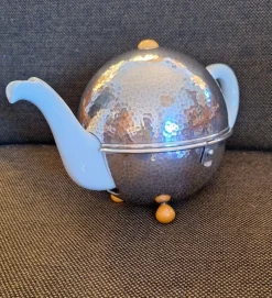 New Pamono Vintage Art Deco German Cream-white Porcelain Spherical Teapot with Silver-Plated Thermal Jacket and Yellow-Brown Bakelite Feet from WMF, 1940s