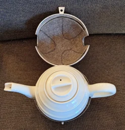 New Pamono Vintage Art Deco German Cream-white Porcelain Spherical Teapot with Silver-Plated Thermal Jacket and Yellow-Brown Bakelite Feet from WMF, 1940s