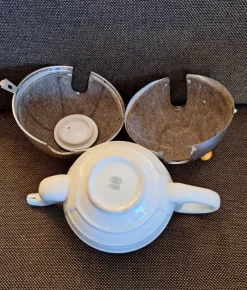 New Pamono Vintage Art Deco German Cream-white Porcelain Spherical Teapot with Silver-Plated Thermal Jacket and Yellow-Brown Bakelite Feet from WMF, 1940s
