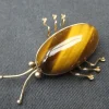 Pamono Vintage Brooch in 14 Karat Gold with Tiger Eye Stone> Brooches