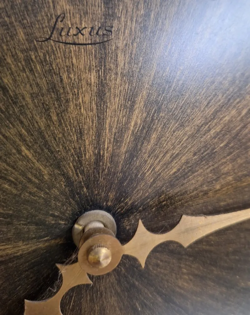 Pamono Vintage Wall Clock Sunburst with Brown Dial and Black Metal Rays from Luxus, 1970s> Watches